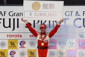 Richard on the podium after winnig the 2010 Japanese Super GT Race
